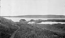 Arctic Red River view of lower part showing Lake, warehouse and summer camps, N.W.T 1929