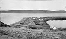 Arctic Red River view of lower part showing Lake warehouse and summer camps, N.W.T 1929
