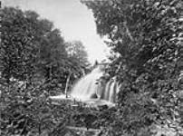 Sceene along the Intercolonial Railway line. Falls/L'Intercolonial. Scène le long de la ligne June-Aug. 1875