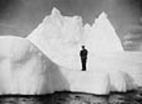 Officer of the Royal Navy (possibly H.R.H. the Prince of Wales) standing on an iceberg 12 Aug. 1919