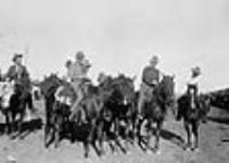 H.R.H. the Prince of Wales riding a broncho with cowboys 11 Sept. 1919