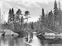 Canoeing amongst islands (cast end). Laurentian Fishing Club ca. 1887