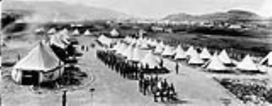 B.C. Horse Camp at Vernon, B.C. with concentration camp in background 1914-1919