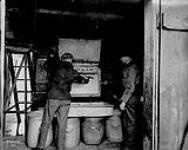 Unloading a mixer. British Explosives Co. Ltd., Renfrew, Ont c. 1914-1918