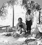 Mi'kmaq woman and two children, Prince Edward Island ca. 1903.