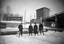 Snow show tramp below Sappers Bridge Ottawa, Ont. [showing Daly & Corry Buildings] ca. 1900