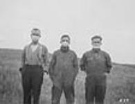 Hommes portant un masque durant l'épidémie de grippe espagnole 1918