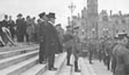 The Duke of Connaught, Rt. Hon. R.L. Borden and General Hughes with staff, inspecting the New Contingents for the war, Ottawa, Ont ca. 1900 - ca. 1939