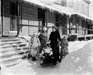 Lady Aberdeen (née Ishbel Marjoribanks) and her children at Rideau Hall. L. to R.: Dudley Gordon, Marjorie Gordon, Haddo Gordon (on sleigh), Lady Aberdeen, and Archie Gordon Jan. 1894