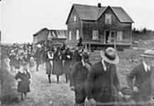 New settlers on their way to a funeral June 1937
