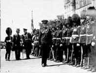 His Excellency [Viscount Willingdon] inspects the Governor General's Foot Guard drawn up on the Hill July 1927