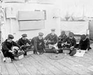 Sewing party on H.M.S. "Proserpine", North America and West Indies Squadron [ca. 1900].