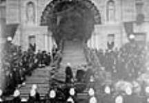 Lieutenant-Governor of British Columbia about to enter Parliament with South African volunteers as a body guard 1901