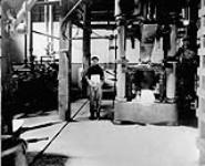 Block of pressed salt, and pressing machine, Dominion Salt Co., Sarnia, Ont 1923 - 1924