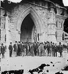 Group of Member of Parliament in front of Parliament Buildings May 1873