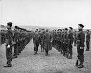 General Gamelin with General A.G.L. McNaughton behind, marches down the ranks of the French Canadians of the Royal 22e Régiment at Guillemont barracks ca. 28 Mar. 1940