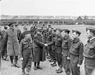 General Gamelin shakes hands with the officers of the Royal 22e Régiment after he reviewed them at Aldershot 28 Mar. 1940