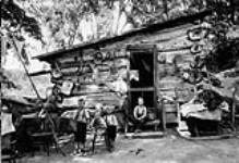 Log cabin, banks of Rideau River near Ottawa. [Ont.] [1920's]