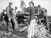 (Relief Projects - No. 33). Personnel loading stone for sidewalk Oct. 1933