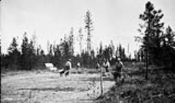 (Relief Projects - No. 62). Road construction with shovel and wheelbarrows one half mile south of the camp July 1933