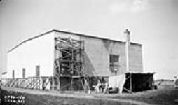 (Relief Projects - No. 90). Painting the hangar wall Aug. 1935