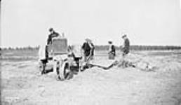 (Relief Projects - No. 92). Allis C Tractor hauling stone Oct. 1935