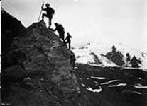 Surveyors ascending mountain in the Chilkat River district
