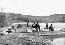 [First Nations crew at Cache Lake Camp]. Original title: Indian crews at Cache Lake Camp [graphic material] 16 July 1887.