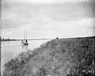 Tracking boat up Fairford River, Man. 1897