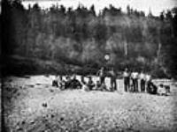 [Haida Indians of Ya-Tza Village, Graham Island, Queen Charlotte Islands, B.C. Chief Edenshaw standing second from left.] Aug. 23, 1878