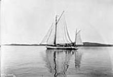 [Yawl with Innu kayak near mouth of Arnaud River] Original title: Yacht with Eskimo Kyaks near mouth of Payne River [graphic material] 1897.