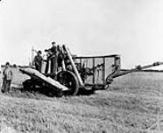 [One of the first harvesters made of sheet metal c. 1921] ca. 1921