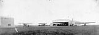 [Aircraft belonging to Western Canada Airways Ltd., outside the hangar at Moose Jaw, Sask., 1930. Left to right: two Boeing 40B-4; two Fokker F-14] 1930
