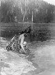 A Clayoquot carries out a ceremonial purification, in order to render himself pleasing to the spirit whale, before practising his dangerous art. [The Clayoquot is a Central Nootka Tribe of British Columbia] 1916