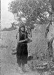 A fruit gatherer in a peach-tree orchard in San Ildefonso, [a Tewa village lying in the Valley of the Rio Grande in north New Mexico] 1926