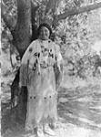 A [Southern] Cheyenne woman in a gala costume made of deerskin, ornamented with porcupinen guill embroidery and with beads and fringe. [Oklahoma] 1930