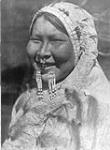 Ugiyaku-Nunivak. Ugiyak [is an Alaskan Eskimo of Nunivak Islands]. She is wearing the typical nose-ring and labret of beads 1930