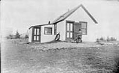 Damas Lonquoy's cabin, and office of Lonquoy Gold Mine, Moose River, Halifax Co., N.S 1897