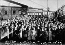 British immigrant children from Dr. Barnardo's Homes at landing stage, Saint John, N.B vers 1920.