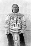 [Inuk woman, Sivura'atsiaq] Unidentified Inuit woman in deerskin coat. Deer teeth were used to decorate the coat n.d.
