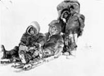 Inuit children sledding near Chesterfield Inlet [1920's]