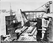 Welland Ship Canal; erecting W. Leaf; unwatering gates N. end Lock No. 8, looking N.W Nov. 13, 1927