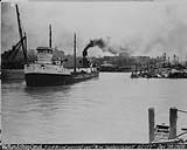 First vessel passing over "New Syphon Culvert," Welland Ship Canal Dec. 7, 1928