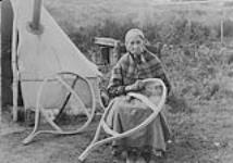 Aboriginal woman making snowshoes [Possibly a Montagnais woman] c.a. 1928