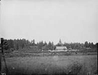 [The Church of England Mission Station at Ut-te-was, a Haida village on Masset Sound, Graham Island, Queen Charlotte Islands, B.C.] 1878