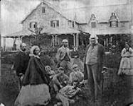 Strickland homestead, Individuals: Third from left, holding baby - Catherine Parr Traill; Second from right, standing - Sam Strickland n.d.