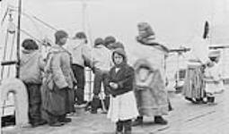 Eskimo visitors on Str. "Early Grey", Port Burwell, [N.W.T.] 1910