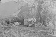 Camp scene at Cinnemousun Narrows 1911