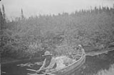 Algonquin family, from Eagle Village First Nation, in their canoe, Kipawa (Kebaowek), Quebec n.d.