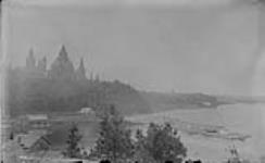 Timber raft on Ottawa River behind Parliament Buildings 1888